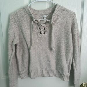 Women’s cream lace up sweater